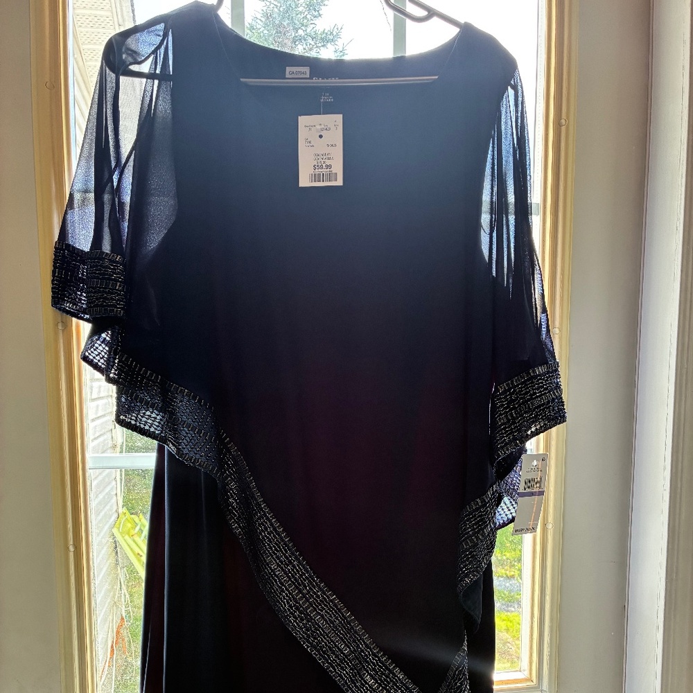 Knee length dress with sheer overlay
